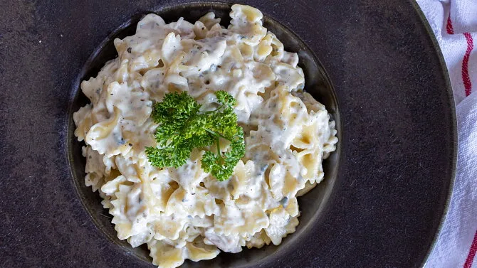 Creamy pasta with parsley garnish