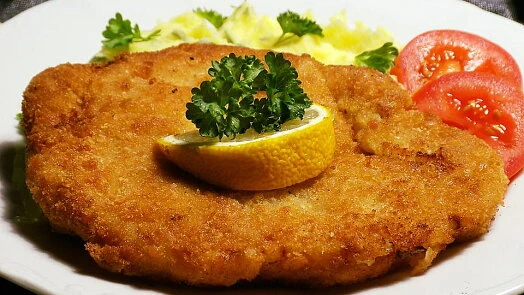Breaded pork cutlet with garnish