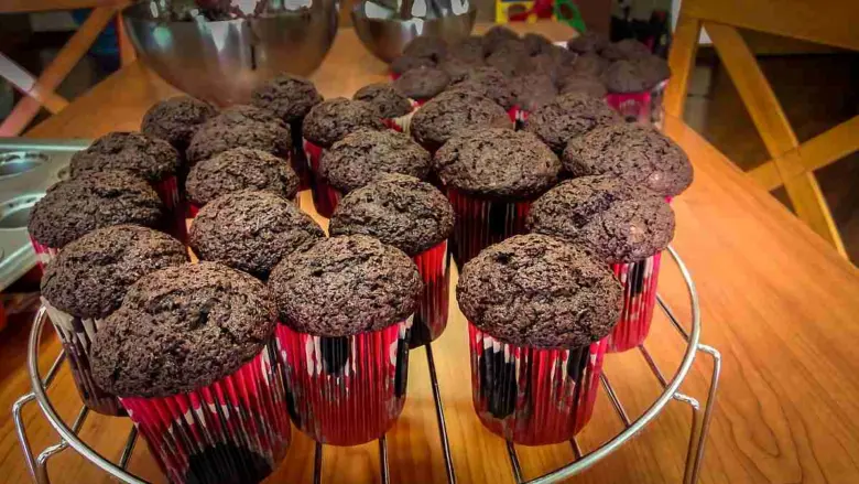 Chocolate muffins on cooling rack