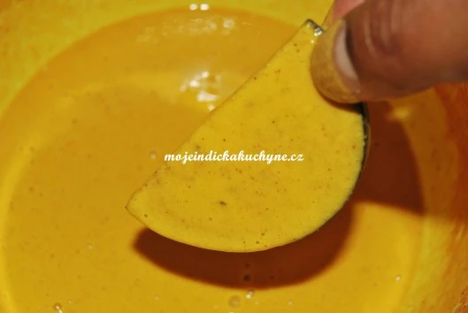 Yellow batter being scooped